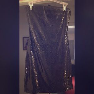 Black strapless black cocktail or clubbing dress.